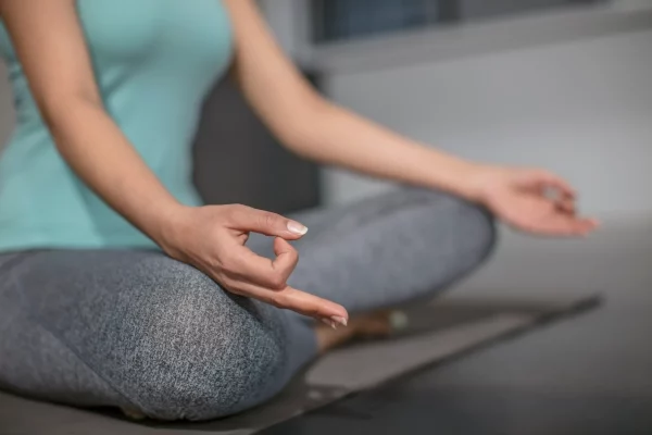 close-up-of-woman-doing-yoga-exercise-in-studio-2022-12-16-22-43-42-utc