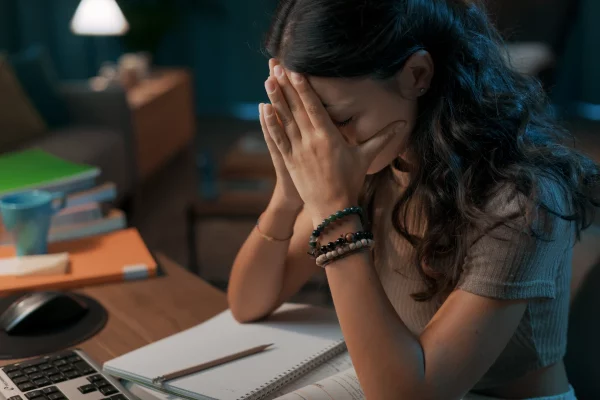 depressed-stressed-woman-sitting-at-desk-2022-11-07-21-27-43-utc