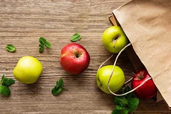 fresh-apples-in-a-paper-bag-on-a-wooden-background-2021-12-09-02-46-40-utc