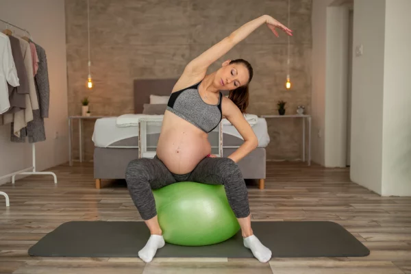 pregnant-woman-stretching-out-2022-08-18-19-04-02-utc